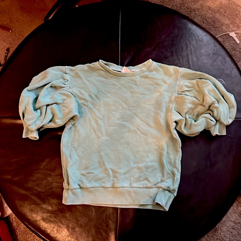Light green puffy sleeved sweatshirt